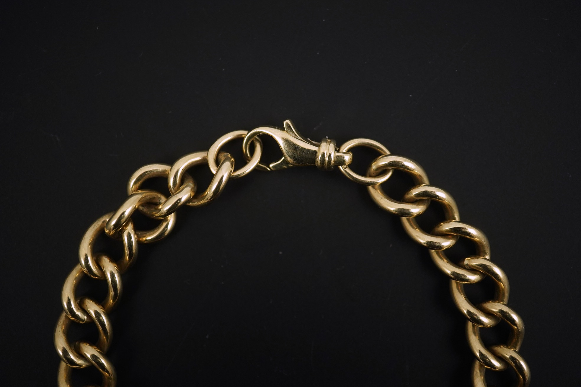 A modern 9ct gold shaped oval link bracelet